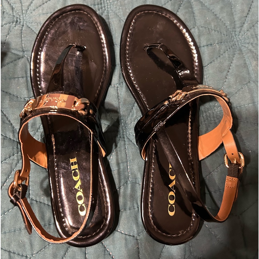 Black Patent Leather T-Strap Sandals wi/Logo Hardware, buckle straps.